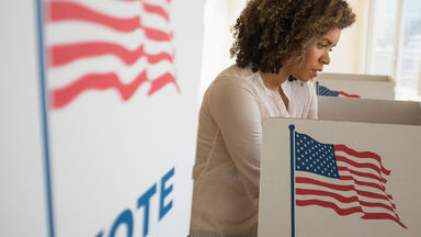 woman at voting booth