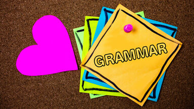 grammar term written on note