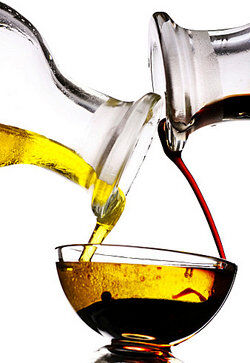 Oil and vinegar being poured into a bowl as examples of density