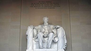 Lincoln memorial with words inscribed above